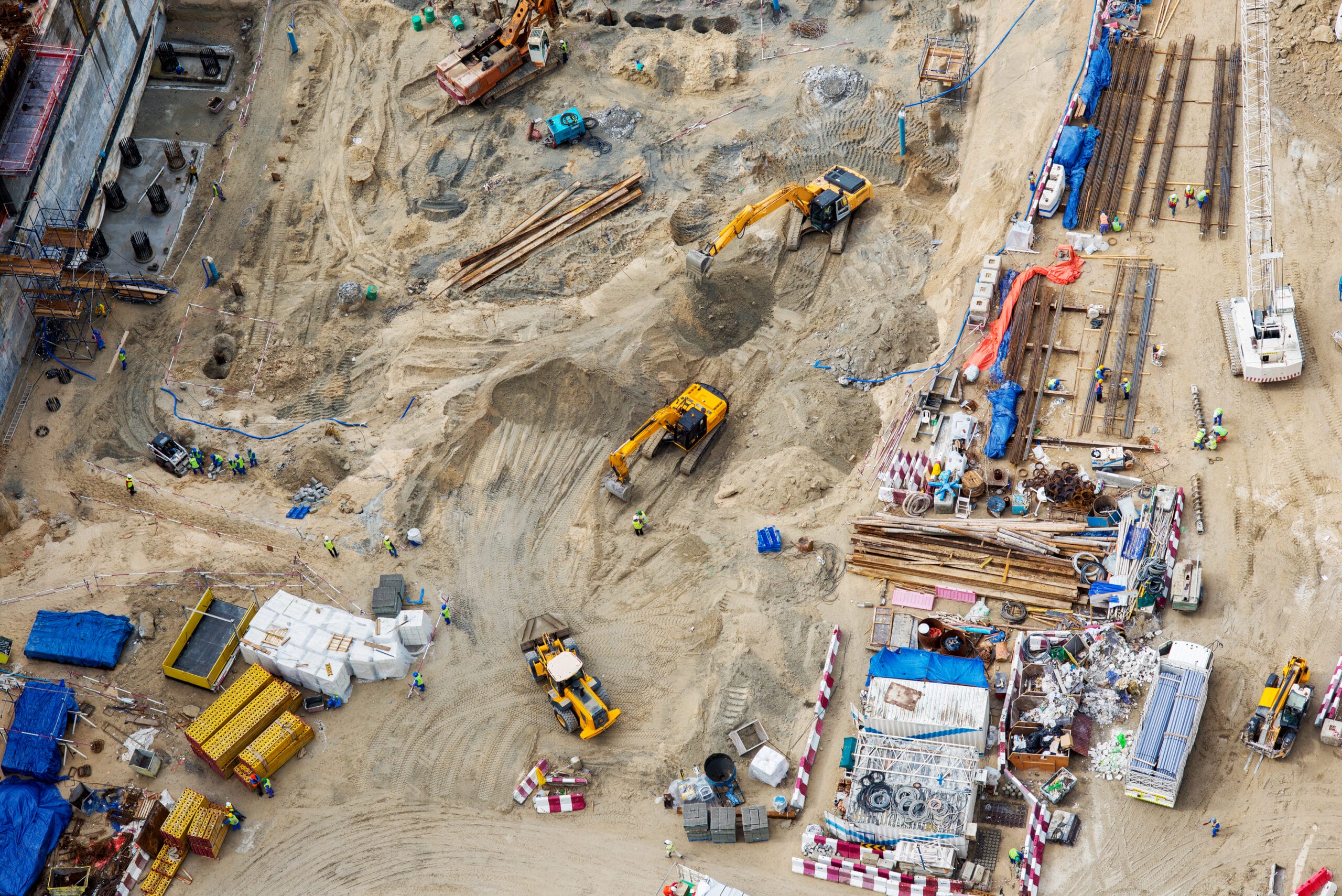 Top view of construction sites and a lot of machines and workers